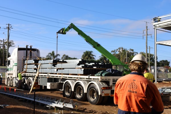 Close up of workers on Akura site showing construction in progress